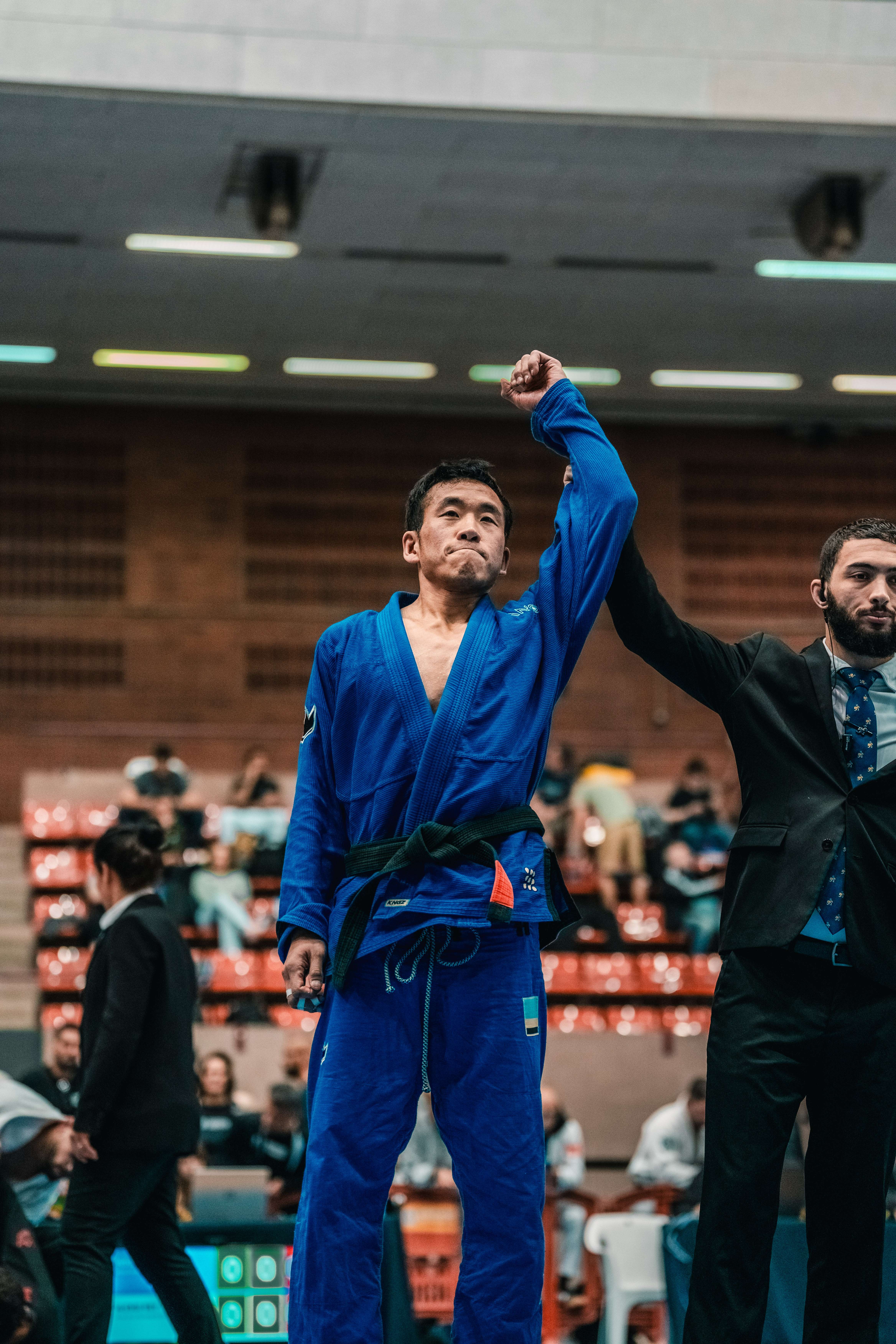 1:1 client with hand raised after competition win